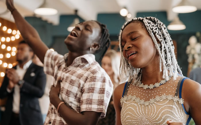 Grace Nation worshippers engaging in praise and worship during church service